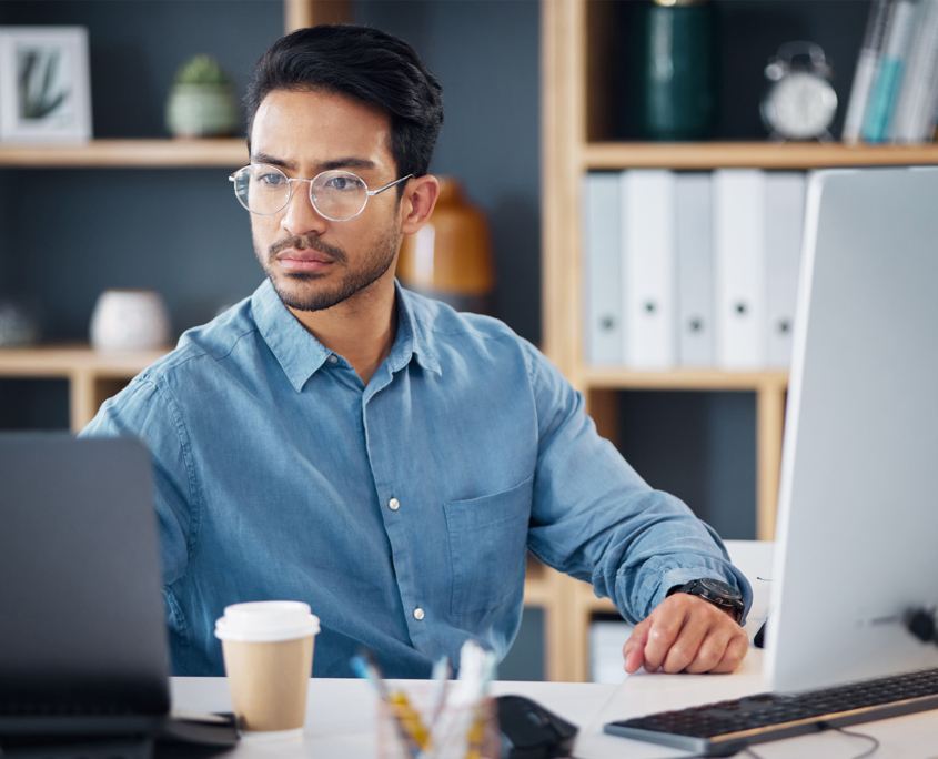 Serious, laptop and business man in office for startup management